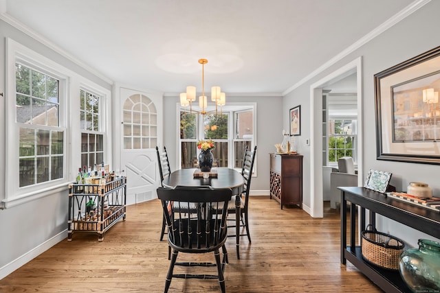 66 Concord St, West Hartford, CT 06119 - dining room featuring a chandelier, crown molding, and light wood finished floors