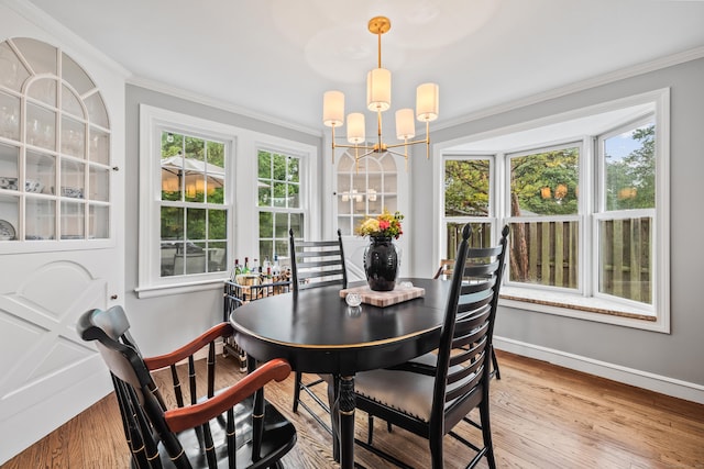 66 Concord St, West Hartford, CT 06119 - dining area with a chandelier, crown molding, and wood finished floors