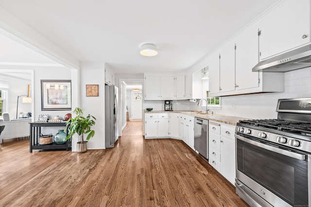 66 Concord St, West Hartford, CT 06119 - kitchen with stainless steel appliances, under cabinet range hood, decorative backsplash, dark wood-type flooring, and white cabinetry