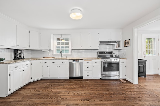 66 Concord St, West Hartford, CT 06119 - kitchen featuring stainless steel appliances, under cabinet range hood, decorative backsplash, and white cabinetry