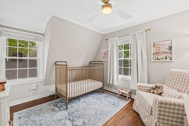 66 Concord St, West Hartford, CT 06119 - bedroom with crown molding, a nursery area, wood finished floors, and ceiling fan