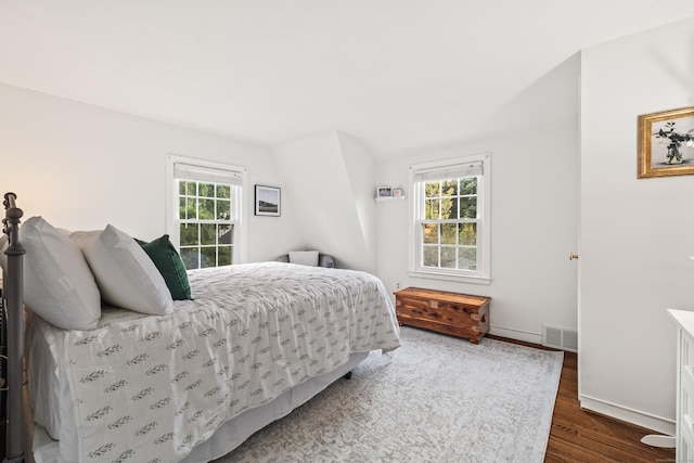 66 Concord St, West Hartford, CT 06119 - bedroom featuring dark wood-type flooring, multiple windows, and lofted ceiling