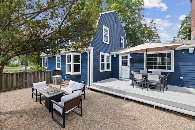 66 Concord St, West Hartford, CT 06119 - back of property featuring outdoor dining space, an outdoor fire pit, and a deck