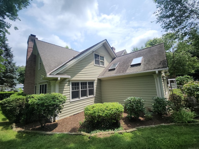 8 Caddy Rd, Norwalk, CT 06851 - view of property exterior with a chimney and a shingled roof