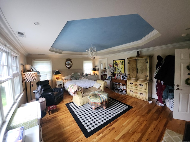 8 Caddy Rd, Norwalk, CT 06851 - bedroom featuring a tray ceiling, a chandelier, wood finished floors, and crown molding