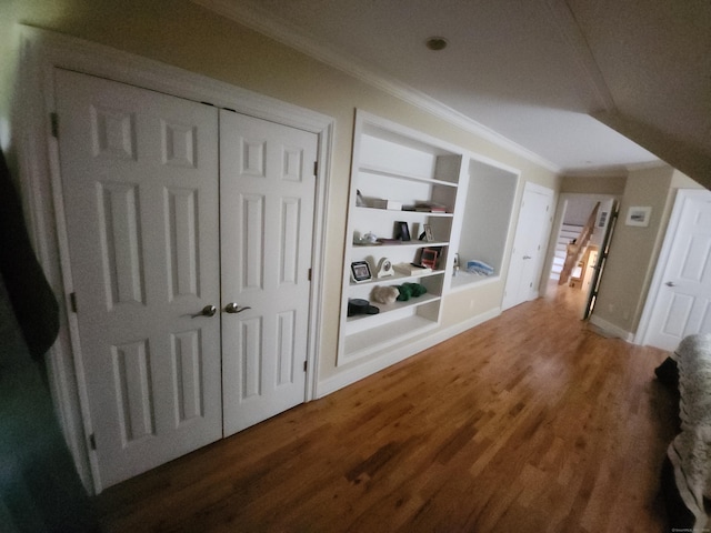 8 Caddy Rd, Norwalk, CT 06851 - corridor with ornamental molding, built in shelves, and wood finished floors