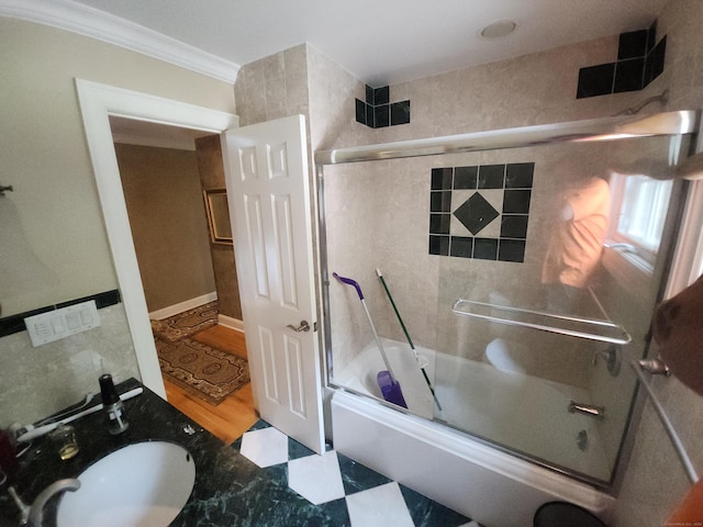 8 Caddy Rd, Norwalk, CT 06851 - full bathroom featuring shower / bath combination with glass door, ornamental molding, and tile walls