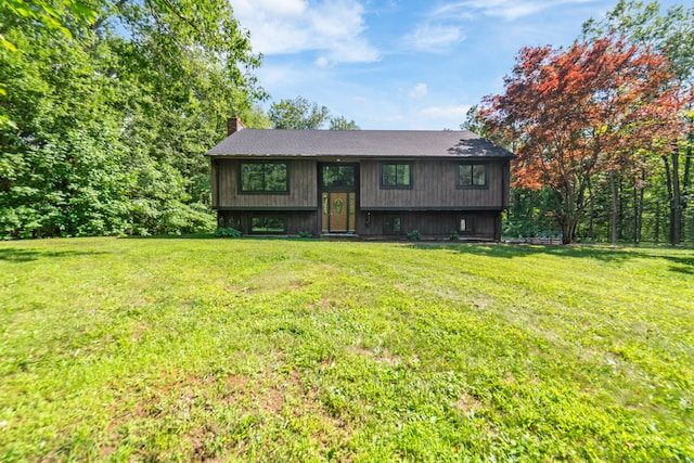 15 Revere Rd, Washington, CT 06793 - split foyer home with a chimney, a front yard, and a shingled roof