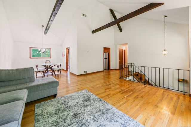 15 Revere Rd, Washington, CT 06793 - living area with high vaulted ceiling, a chandelier, beam ceiling, and wood finished floors