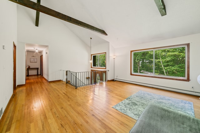 15 Revere Rd, Washington, CT 06793 - empty room with a baseboard radiator, high vaulted ceiling, beam ceiling, and wood finished floors