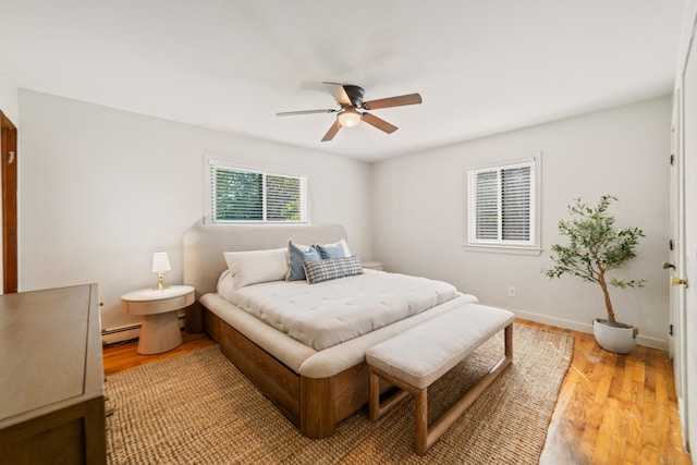 15 Revere Rd, Washington, CT 06793 - bedroom with baseboard heating, light wood finished floors, and a ceiling fan