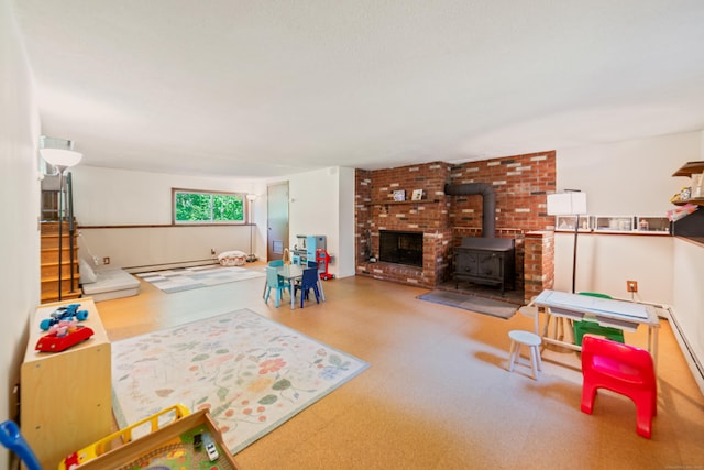 15 Revere Rd, Washington, CT 06793 - living room featuring a wood stove and baseboard heating