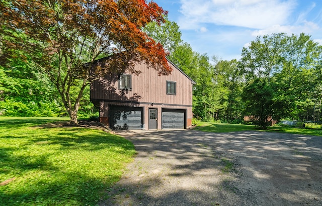 15 Revere Rd, Washington, CT 06793 - view of side of property with a garage, a lawn, and driveway