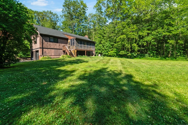 15 Revere Rd, Washington, CT 06793 - view of green lawn with a sunroom, stairs, and an attached garage