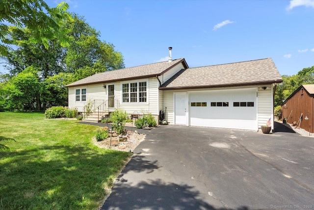 367 Pine Hill Rd, Sterling, CT 06377 - single story home with driveway, an attached garage, and a front lawn