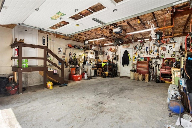 367 Pine Hill Rd, Sterling, CT 06377 - garage with a workshop area and a garage door opener