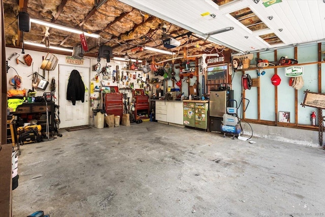 367 Pine Hill Rd, Sterling, CT 06377 - garage featuring a workshop area and a garage door opener