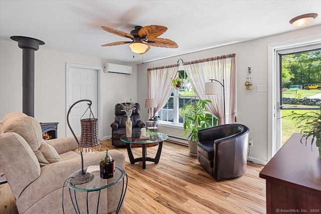 367 Pine Hill Rd, Sterling, CT 06377 - living room featuring healthy amount of natural light, light wood finished floors, a ceiling fan, and an AC wall unit