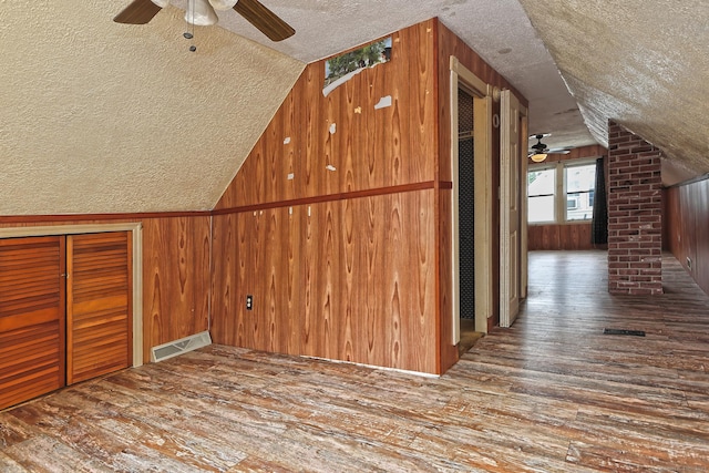 205 Lee St, West Haven, CT 06516 - bonus room featuring a textured ceiling, a ceiling fan, vaulted ceiling, hardwood / wood-style flooring, and wood walls