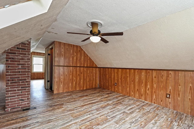 205 Lee St, West Haven, CT 06516 - bonus room with a textured ceiling, wood finished floors, wooden walls, a ceiling fan, and vaulted ceiling
