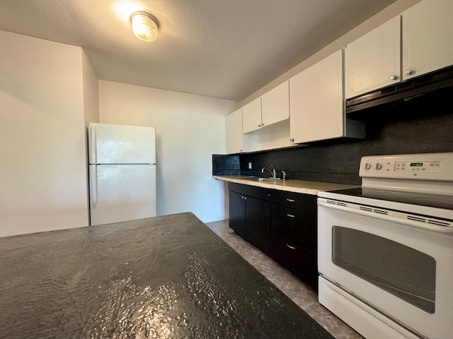 1730 State St Apt 306, Hamden, CT 06517 - kitchen with white appliances, extractor fan, white cabinets, dark cabinets, and light countertops