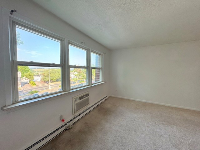 1730 State St Apt 306, Hamden, CT 06517 - carpeted empty room featuring a baseboard heating unit, a textured ceiling, and a wall mounted AC