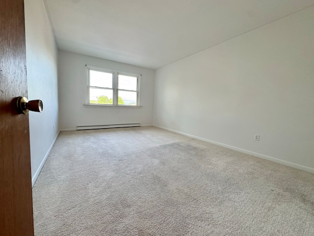 1730 State St Apt 306, Hamden, CT 06517 - carpeted empty room featuring a baseboard radiator and baseboards