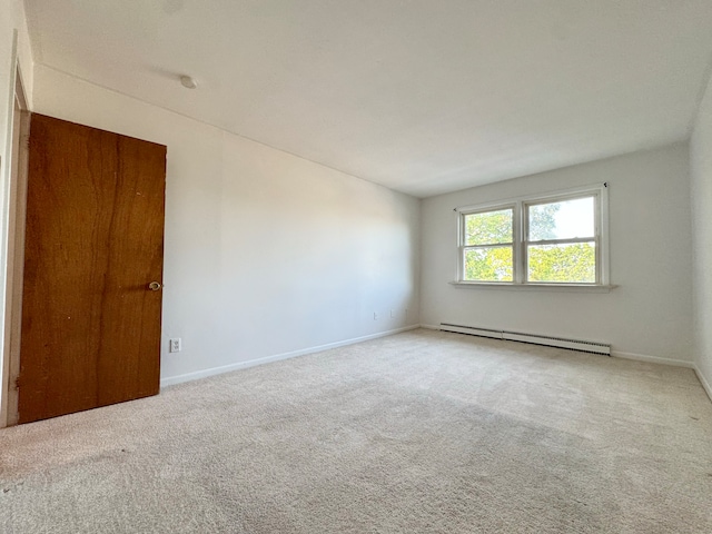1730 State St Apt 306, Hamden, CT 06517 - carpeted empty room featuring a baseboard radiator and baseboards