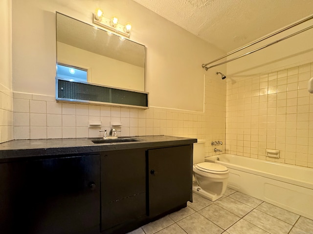 1730 State St Apt 306, Hamden, CT 06517 - bathroom featuring tile walls, tile patterned floors, vanity, washtub / shower combination, and a textured ceiling