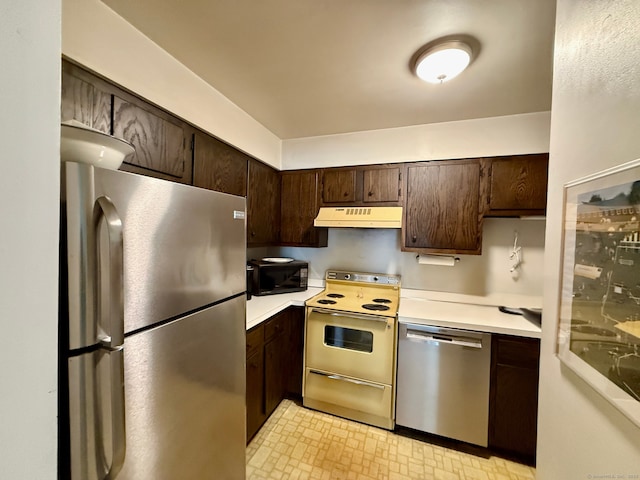 92 Wilton Crst, Wilton, CT 06897 - kitchen with stainless steel appliances, under cabinet range hood, light countertops, and dark brown cabinets