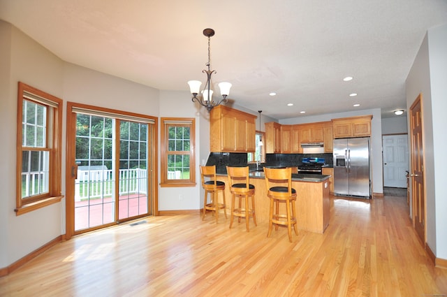 146 Pheasant Way S, Windsor, CT 06074 - kitchen featuring stainless steel appliances, light wood finished floors, a chandelier, a peninsula, and recessed lighting