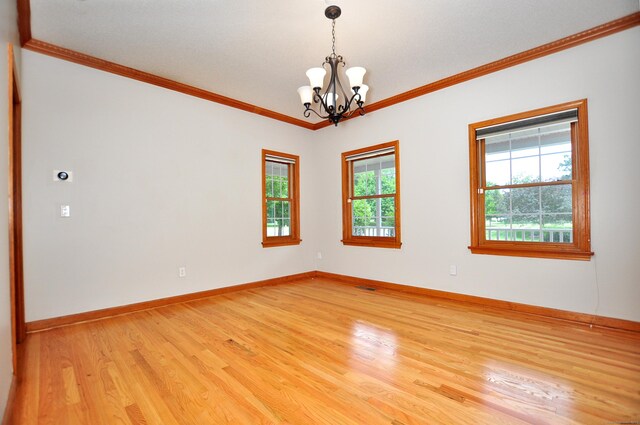 146 Pheasant Way S, Windsor, CT 06074 - empty room with a chandelier, light wood-type flooring, and ornamental molding