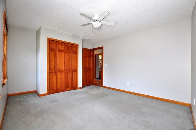 146 Pheasant Way S, Windsor, CT 06074 - unfurnished bedroom featuring a closet, light carpet, a textured ceiling, and a ceiling fan