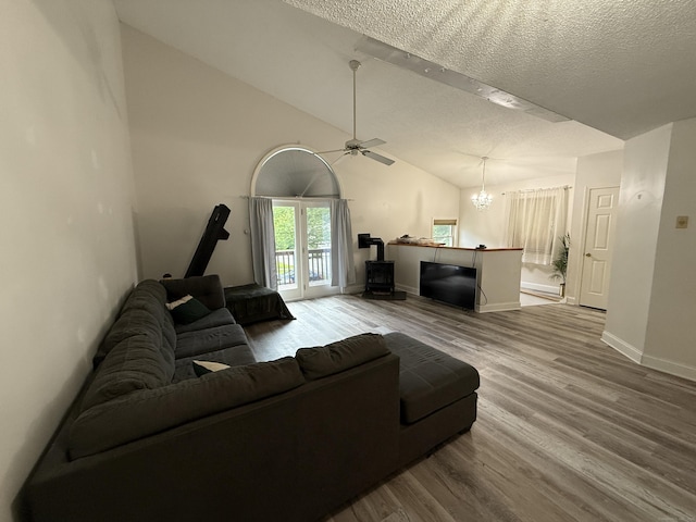 401 Essex Ct Unit 401, Torrington, CT 06790 - living area featuring wood finished floors, a textured ceiling, lofted ceiling, a ceiling fan, and a chandelier