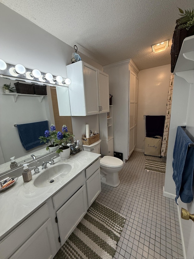 401 Essex Ct Unit 401, Torrington, CT 06790 - bathroom featuring vanity, a textured ceiling, and tile patterned flooring