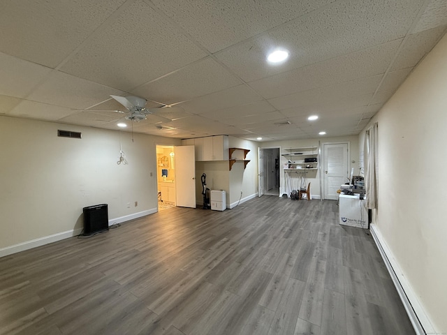401 Essex Ct Unit 401, Torrington, CT 06790 - unfurnished living room featuring a baseboard heating unit, a ceiling fan, dark wood-style flooring, recessed lighting, and a paneled ceiling
