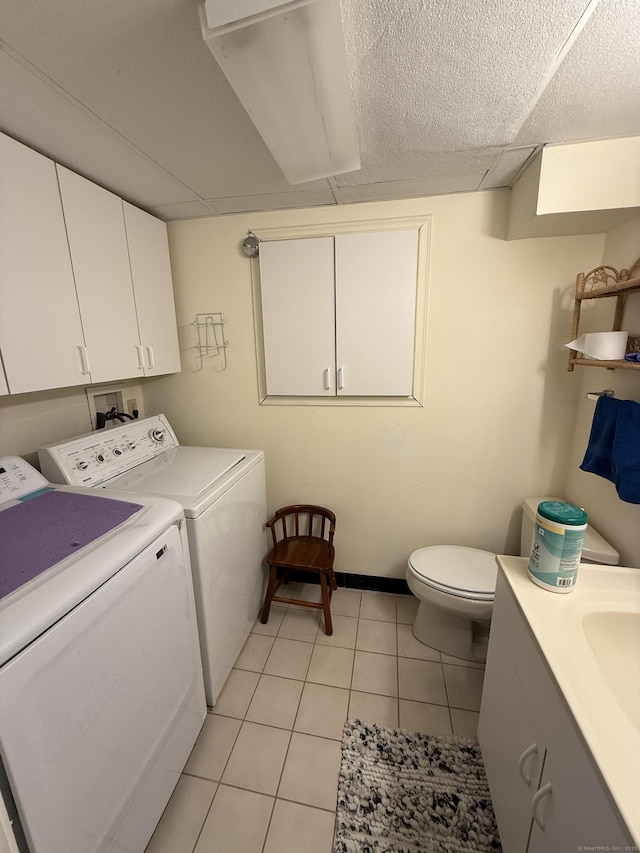 401 Essex Ct Unit 401, Torrington, CT 06790 - laundry room featuring washer and clothes dryer and light tile patterned flooring