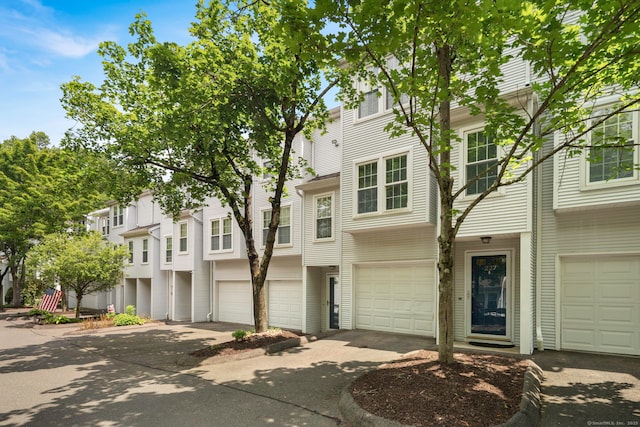380 Hitchcock Rd Unit 227, Waterbury, CT 06705 - view of property featuring driveway and a garage