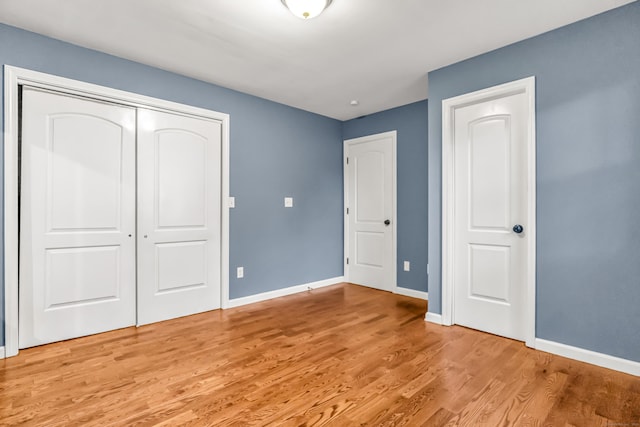 85 Floral Way, Stratford, CT 06615 - unfurnished bedroom featuring light wood finished floors and a closet