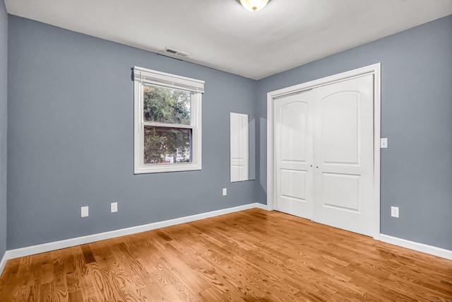 85 Floral Way, Stratford, CT 06615 - unfurnished bedroom with wood finished floors and a closet