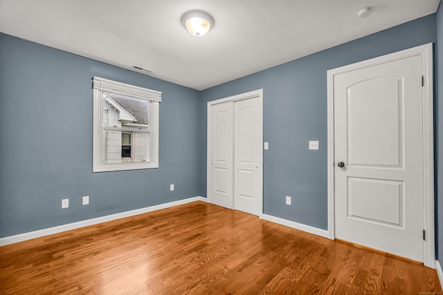 85 Floral Way, Stratford, CT 06615 - unfurnished bedroom featuring a closet and wood finished floors