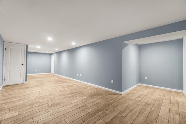 85 Floral Way, Stratford, CT 06615 - finished below grade area with light wood-style floors and recessed lighting