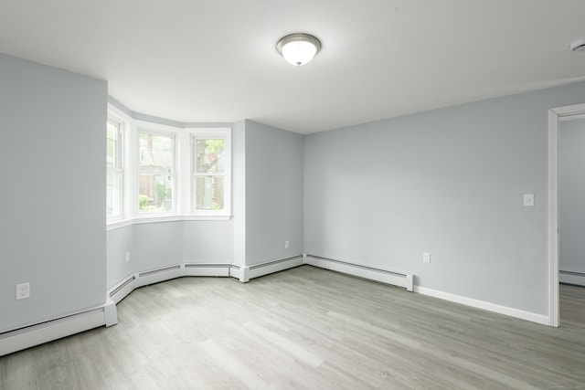 37 Martin St, Hartford, CT 06120 - empty room with wood finished floors and baseboard heating