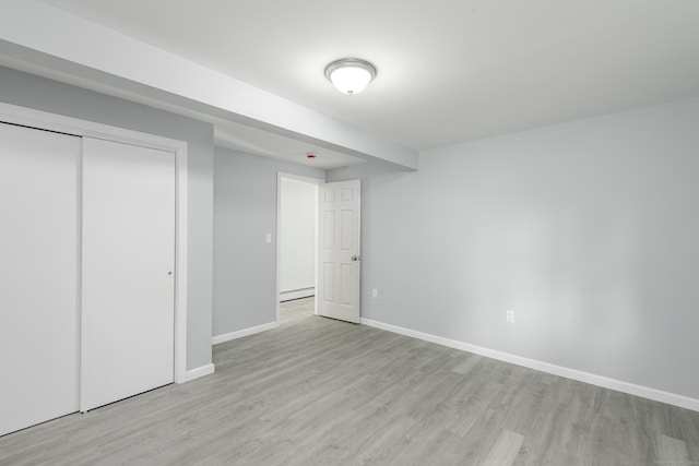 37 Martin St, Hartford, CT 06120 - unfurnished bedroom with wood finished floors, a closet, and baseboard heating