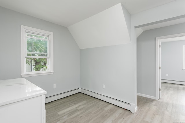 37 Martin St, Hartford, CT 06120 - additional living space featuring light wood finished floors, a baseboard heating unit, baseboard heating, and vaulted ceiling