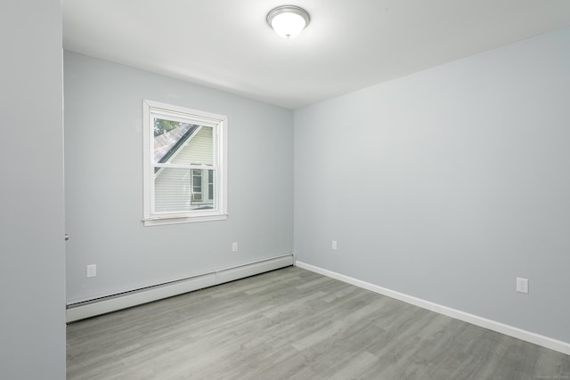 37 Martin St, Hartford, CT 06120 - spare room featuring a baseboard heating unit and wood finished floors