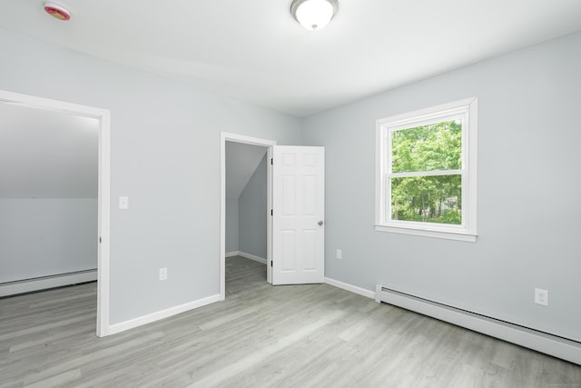 37 Martin St, Hartford, CT 06120 - unfurnished bedroom featuring baseboard heating, wood finished floors, and a spacious closet