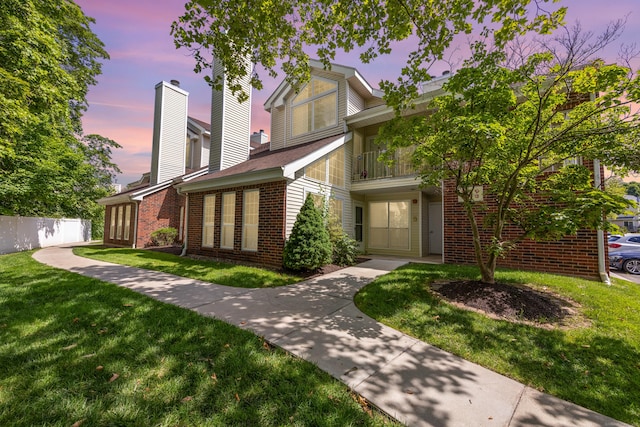 289 Carriage Crossing Ln Unit 289, Middletown, CT 06457 - traditional-style house with brick siding, a balcony, and a chimney