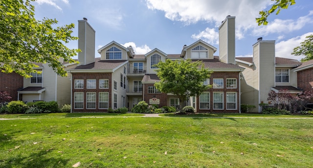 289 Carriage Crossing Ln Unit 289, Middletown, CT 06457 - back of house featuring brick siding and a yard
