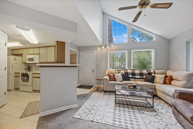 289 Carriage Crossing Ln Unit 289, Middletown, CT 06457 - living area featuring vaulted ceiling, ceiling fan, and light tile patterned flooring